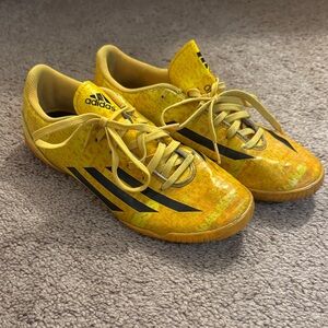 Adidas F10 turf Messi yellow cleats.